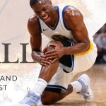 Basketball player holding painful knee on indoor court illustrating jumper’s knee patellar tendon pain below the kneecap Dr. Tomislav Orthopedic Surgeon in Dubai United Arab Emirates