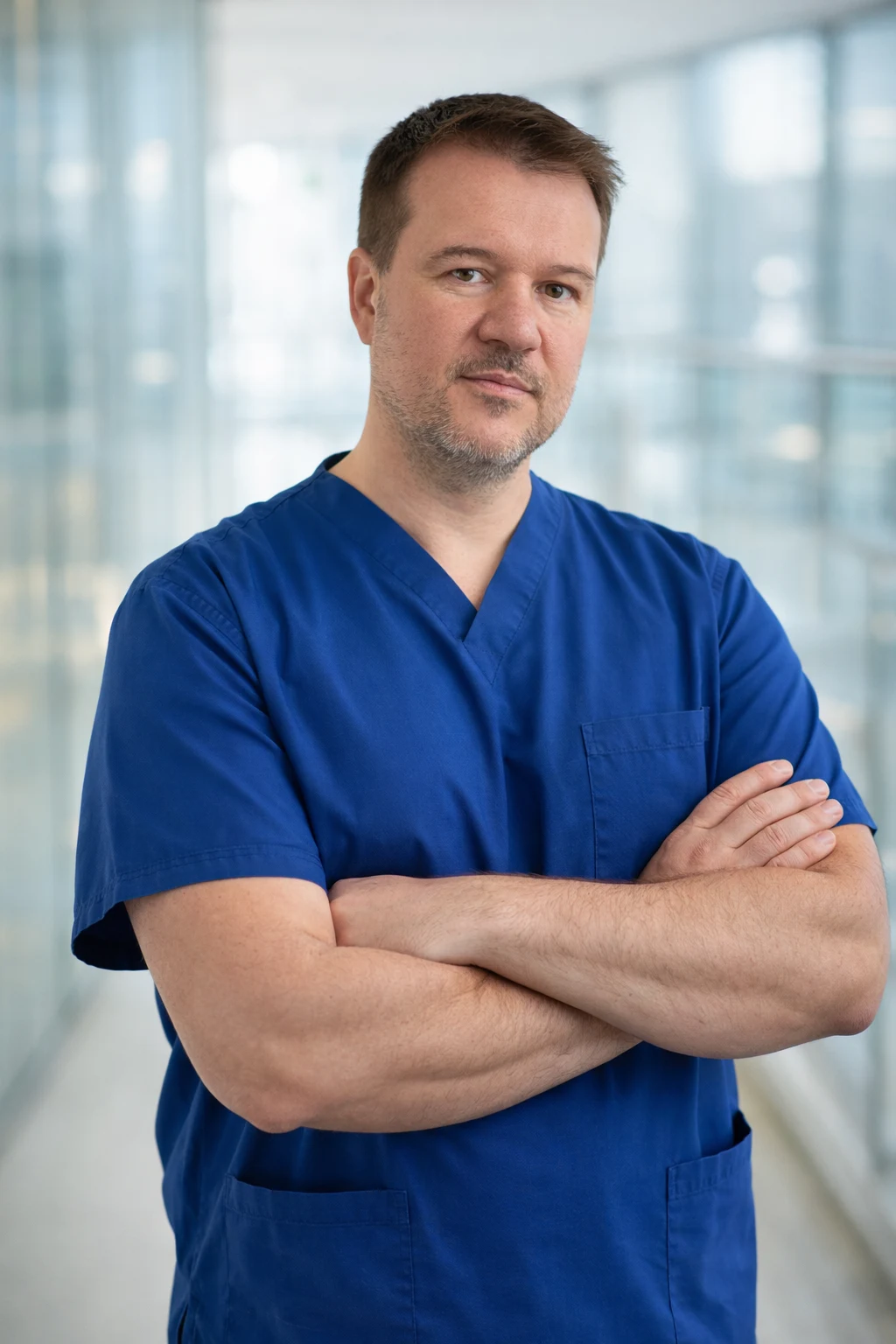 Dr Tomislav Cerovecki Orthopedic surgeon Dubai UAE in blue surgeical scrub